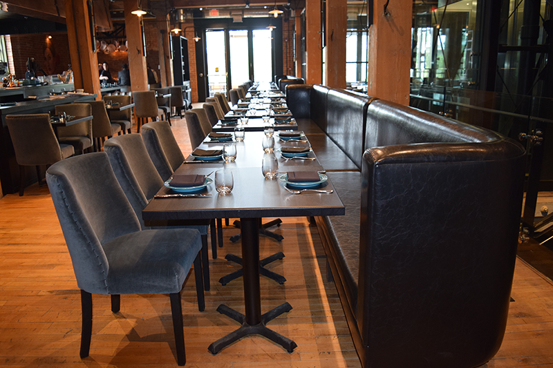 Grey bench seating in a restaurant
