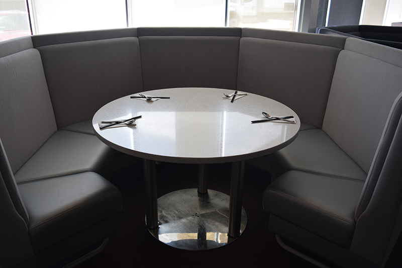 Grey semi-circle seating in a restaurant