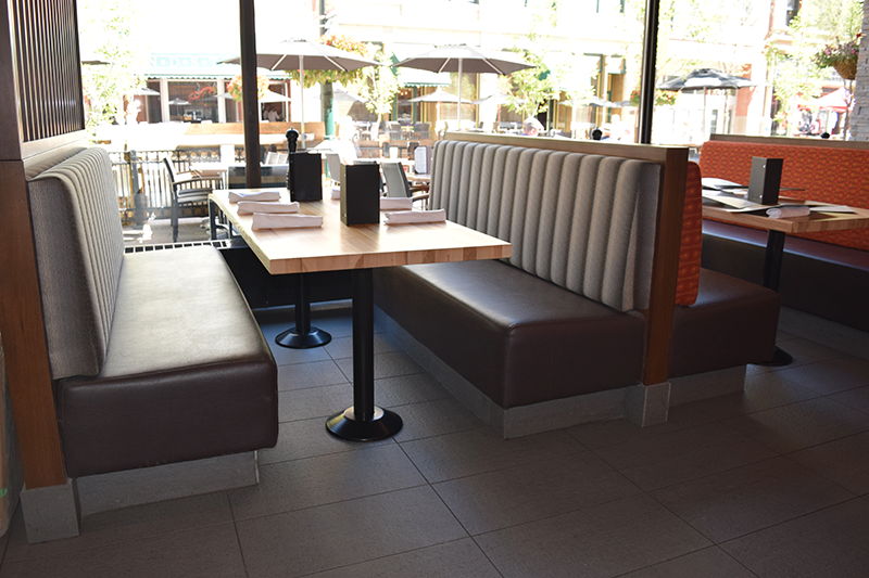 Side view of grey bench seating in a restaurant